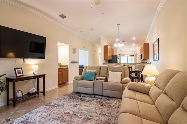 tiled living room with crown molding and ceiling fan with notable chandelier