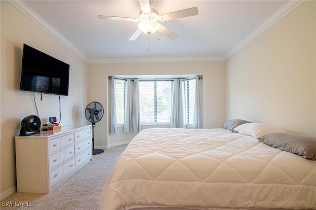 carpeted bedroom with ceiling fan and crown molding