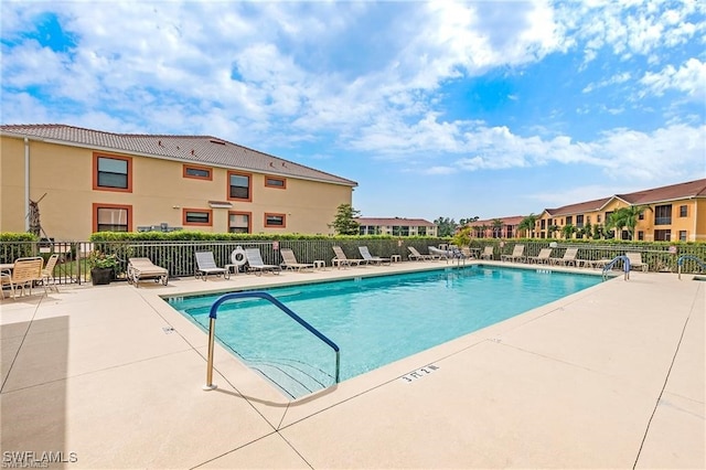 view of swimming pool featuring a patio