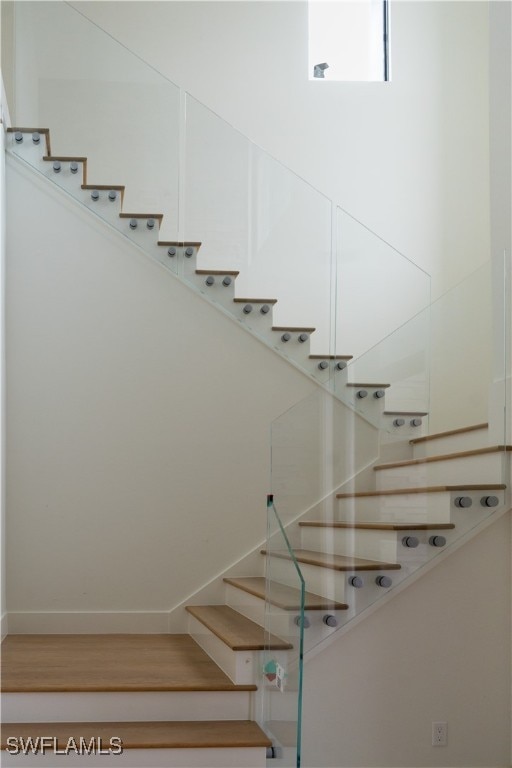 stairs with wood-type flooring