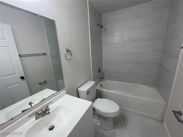 full bathroom featuring vanity, toilet, and tiled shower / bath