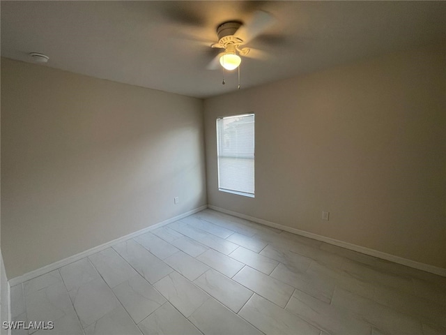 spare room featuring ceiling fan