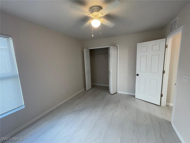 unfurnished bedroom with a closet and ceiling fan