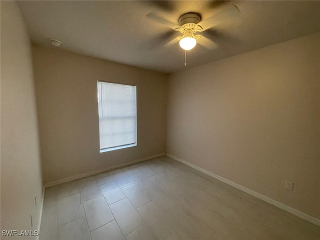 spare room with ceiling fan