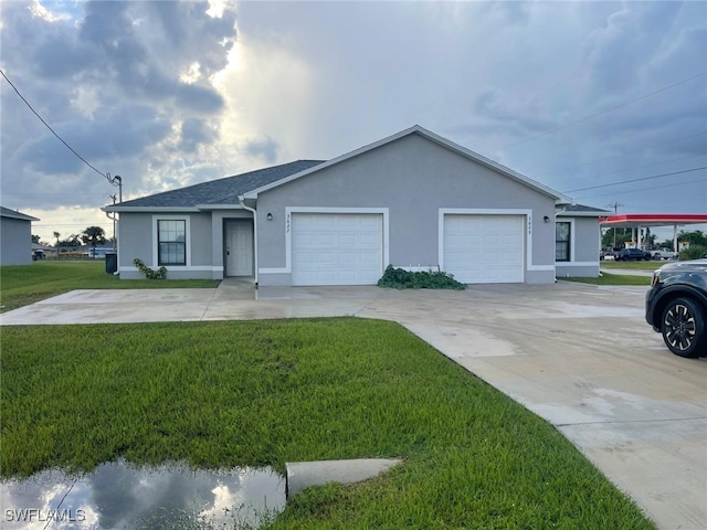 ranch-style home featuring a garage and a front lawn