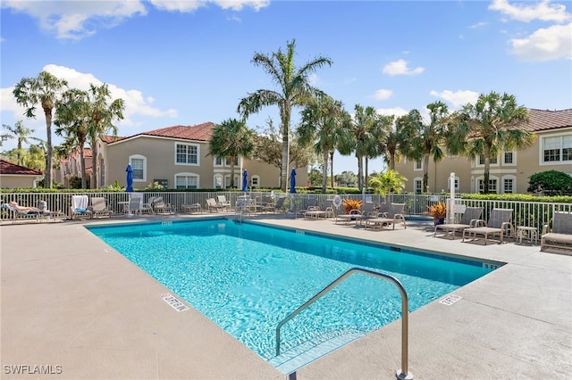 view of swimming pool featuring a patio area