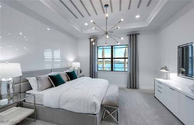 bedroom featuring light colored carpet, a raised ceiling, crown molding, and a notable chandelier