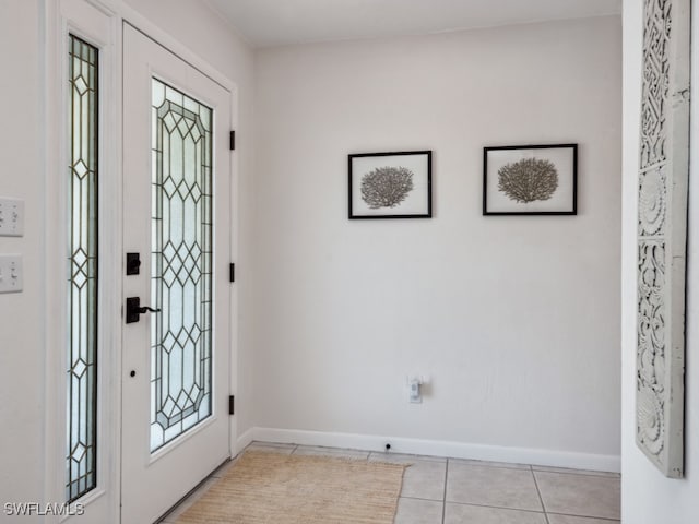 foyer entrance featuring light tile patterned flooring