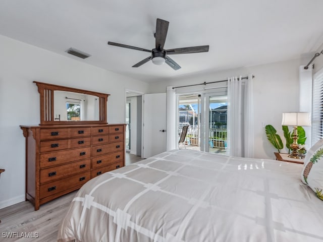 bedroom featuring access to exterior, ceiling fan, and light hardwood / wood-style flooring