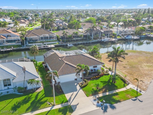 drone / aerial view with a water view