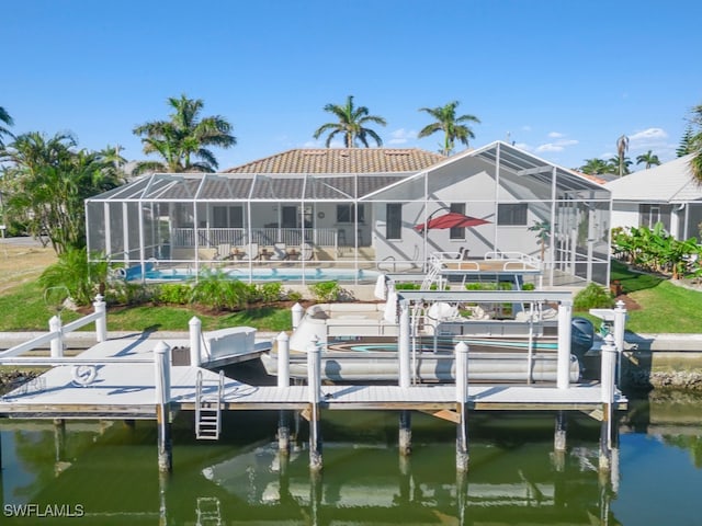 view of dock featuring a water view and a lanai