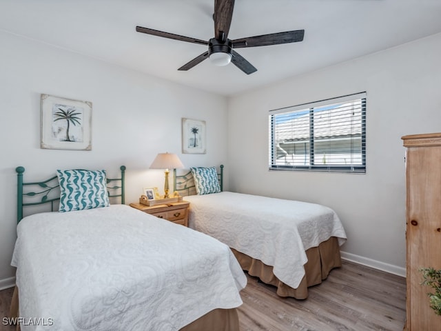 bedroom with ceiling fan and light hardwood / wood-style flooring