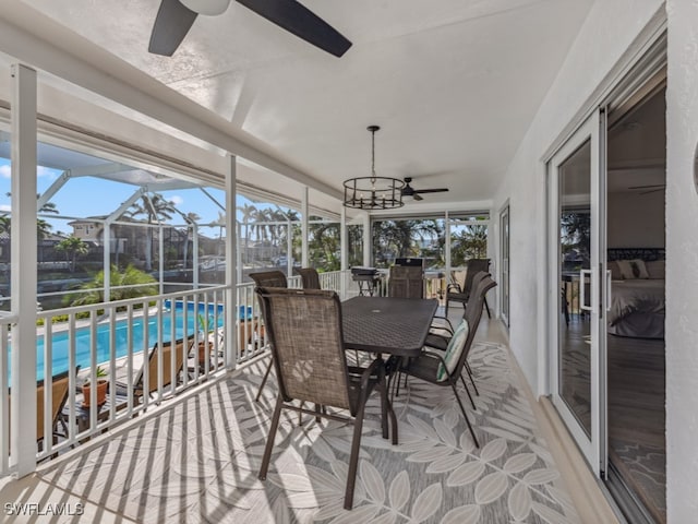 sunroom / solarium with ceiling fan and plenty of natural light