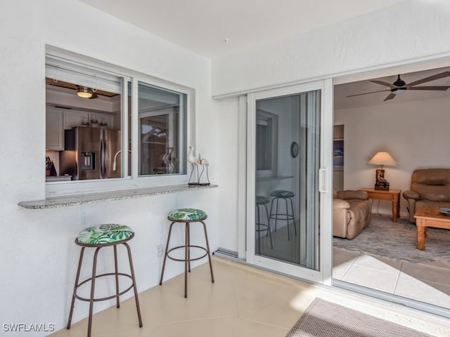 interior space featuring ceiling fan