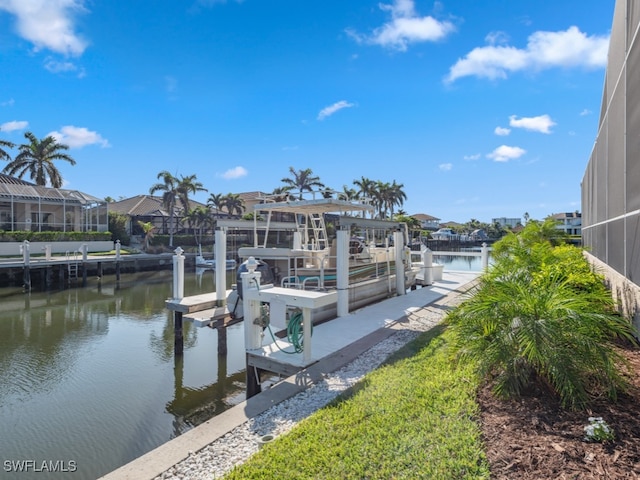 dock area featuring a water view and a lanai