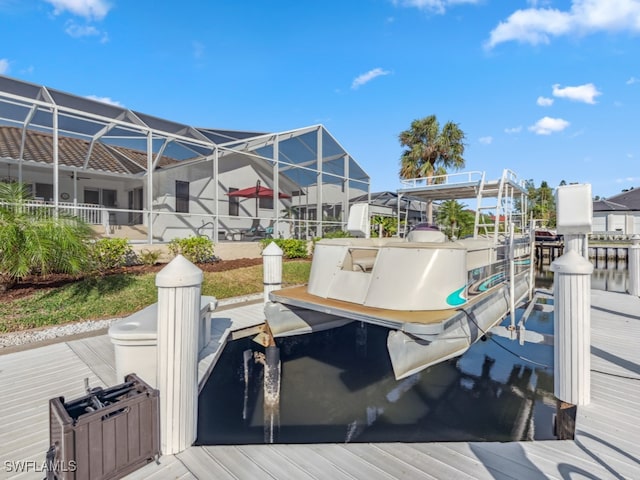 dock area with glass enclosure and a water view