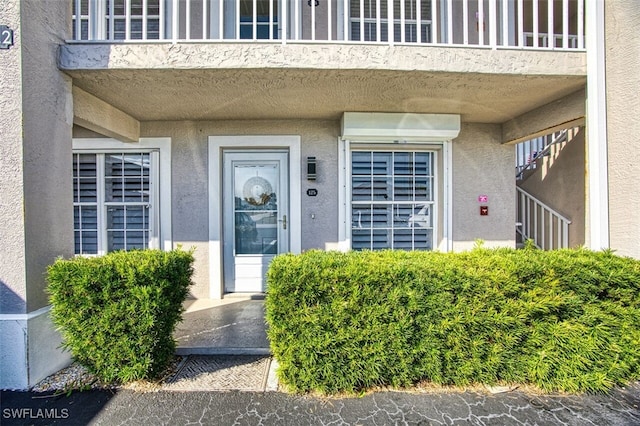 property entrance with a balcony