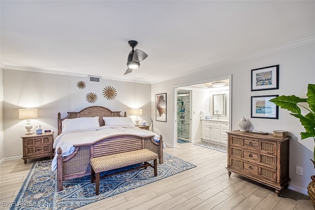 bedroom with ensuite bathroom, ceiling fan, light wood-type flooring, and ornamental molding