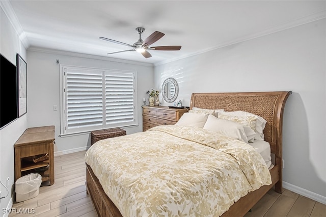 bedroom featuring ceiling fan, crown molding, and light wood-type flooring