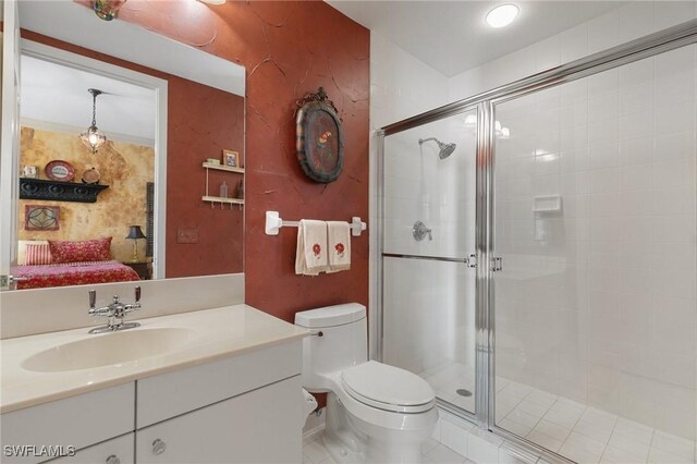 bathroom featuring vanity, toilet, and walk in shower