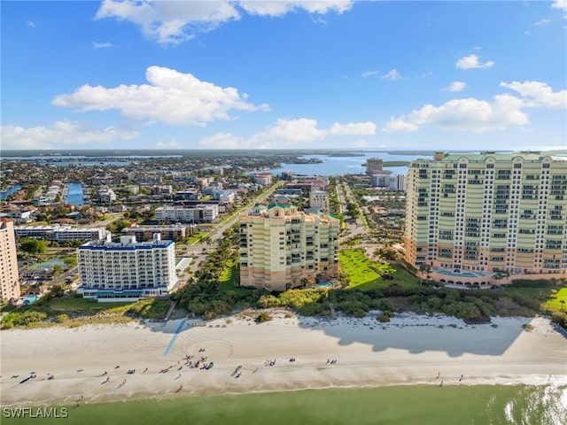 bird's eye view with a water view and a view of the beach