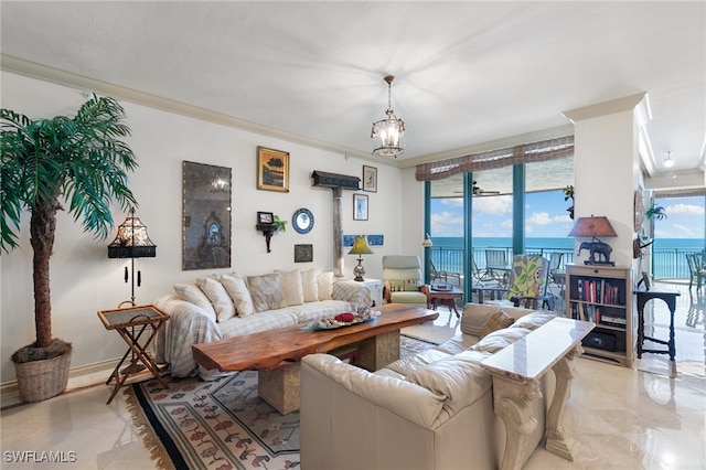 living room featuring a chandelier, a water view, and crown molding