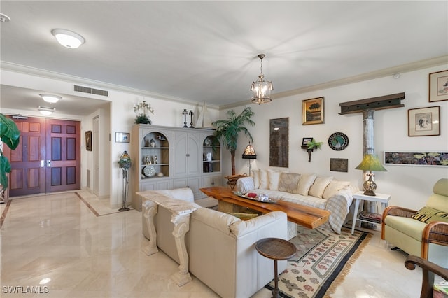 living room featuring ornamental molding and a chandelier