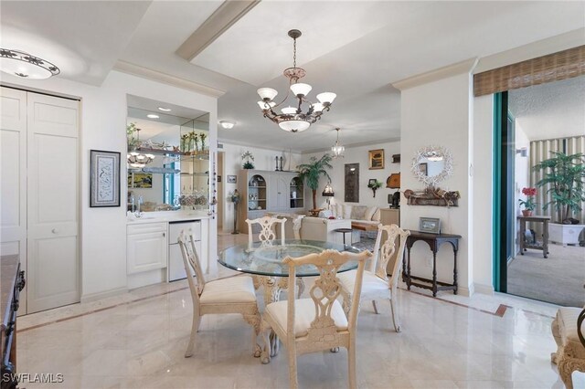 dining room with an inviting chandelier and sink