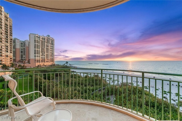 balcony at dusk with a water view