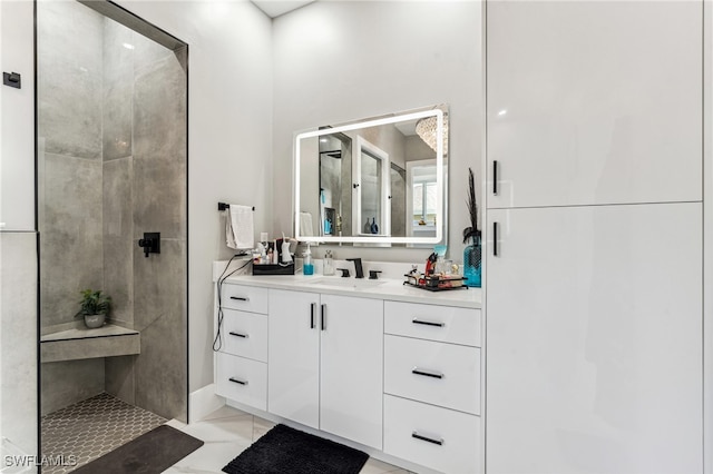 bathroom with tile patterned flooring and vanity