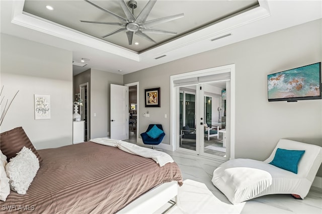 bedroom with a raised ceiling, ceiling fan, and access to exterior