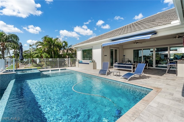 view of pool featuring ceiling fan, a patio area, and an in ground hot tub