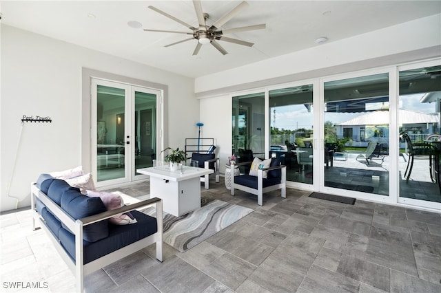 view of patio with an outdoor living space and ceiling fan