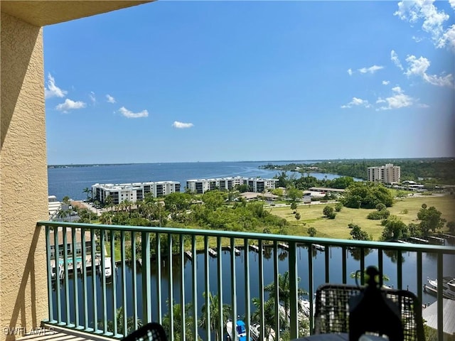 balcony featuring a water view