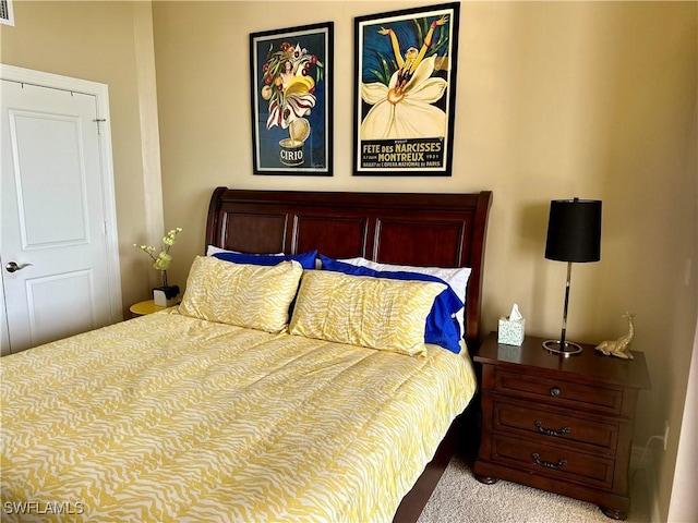 bedroom with light colored carpet