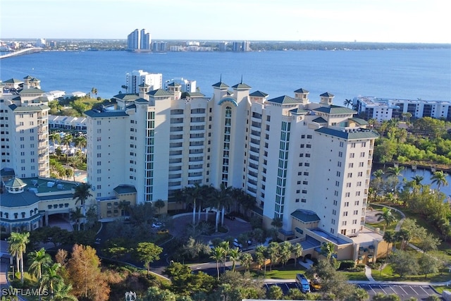 birds eye view of property with a view of city and a water view