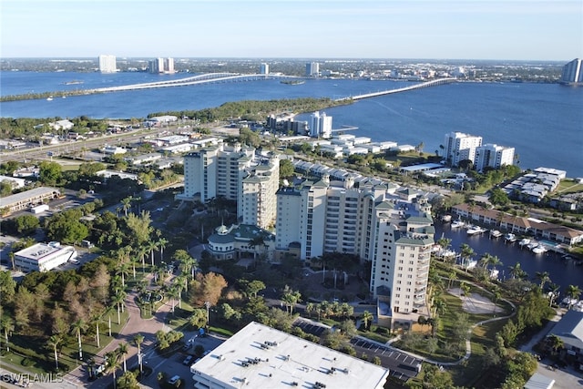 birds eye view of property featuring a water view and a city view