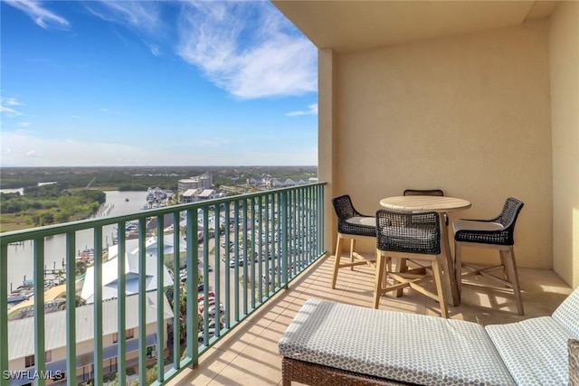 balcony featuring a water view