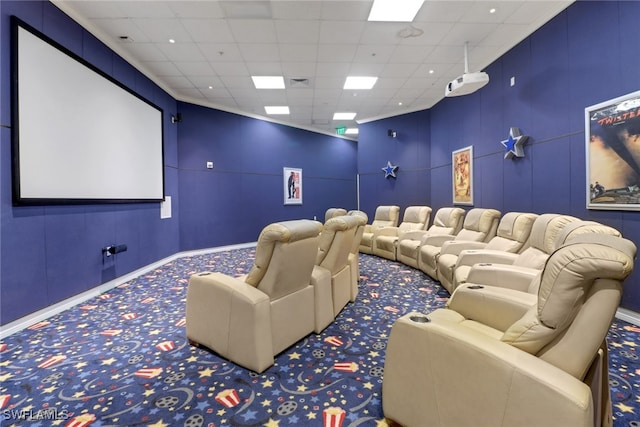 carpeted cinema featuring a drop ceiling, baseboards, and visible vents