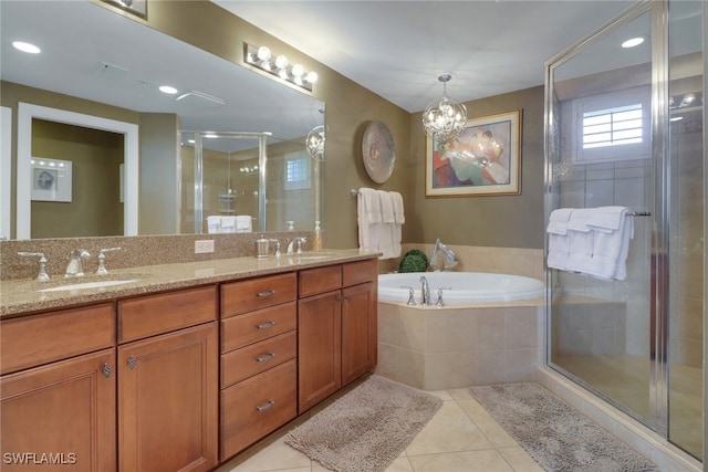 bathroom with tile patterned floors, a shower stall, a bath, and a sink