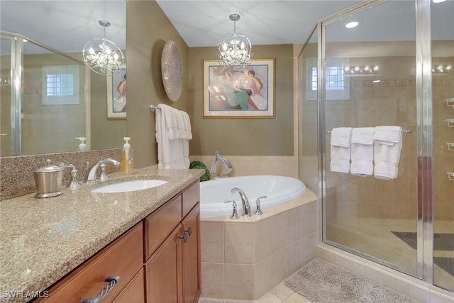 full bath featuring a stall shower, vanity, a bath, and tile patterned floors