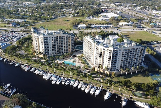 birds eye view of property featuring a view of city and a water view