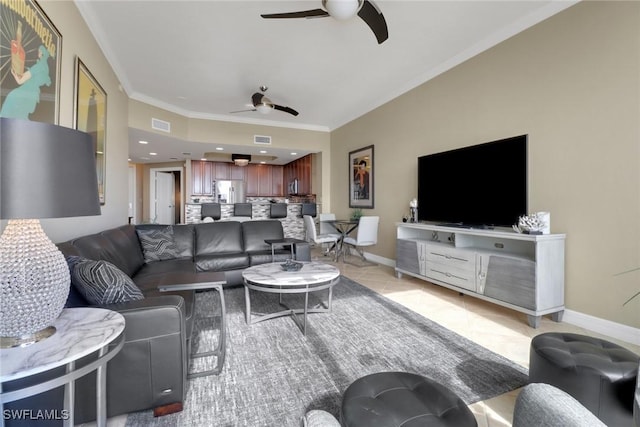 living area featuring crown molding, visible vents, baseboards, and ceiling fan