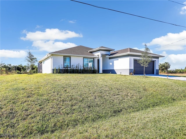 view of front facade featuring a garage and a front lawn