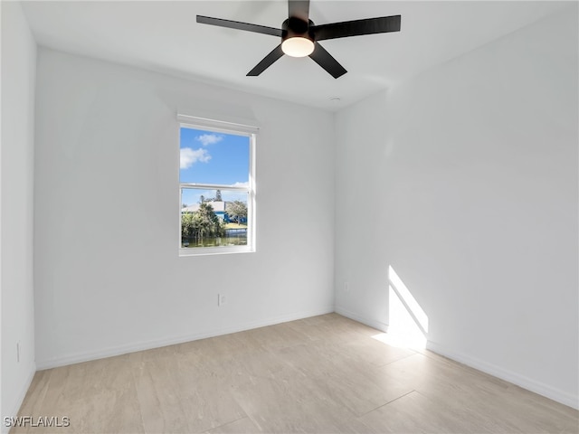 spare room featuring ceiling fan and light wood-type flooring