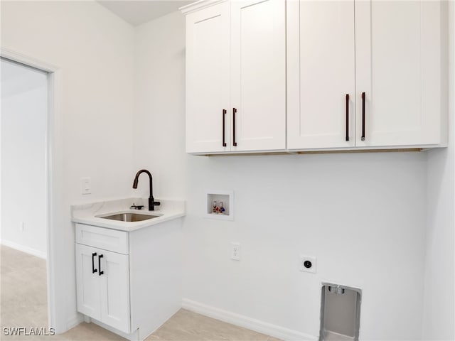 laundry area with cabinets, washer hookup, electric dryer hookup, and sink