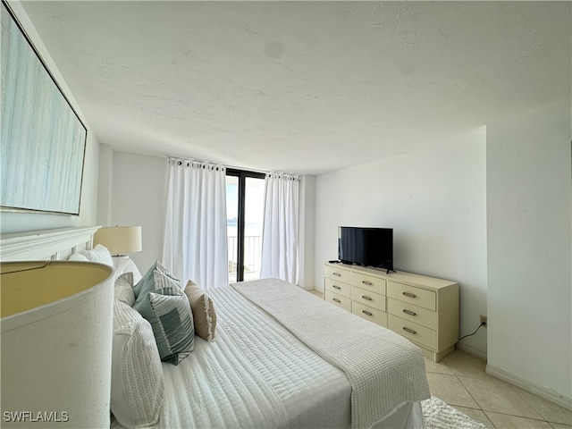 tiled bedroom with a textured ceiling