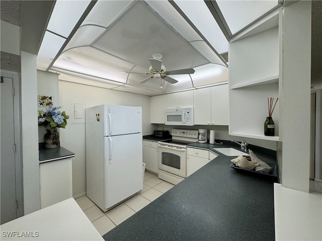 kitchen with white appliances, white cabinets, sink, ceiling fan, and light tile patterned flooring