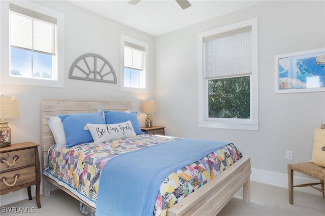 carpeted bedroom featuring ceiling fan