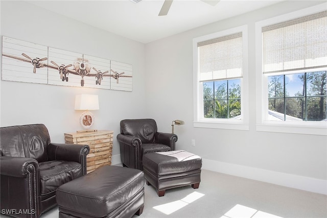 sitting room featuring carpet flooring and ceiling fan